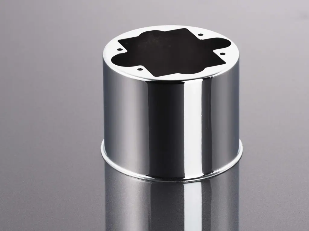 Cilindro metallico con superficie lucida come esempio di finitura superficiale.